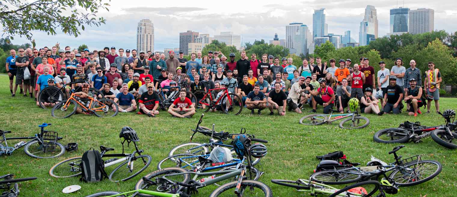 Many Erik's employees stopped on a hill overlooking Minneapolis during a big group bicycle ride.